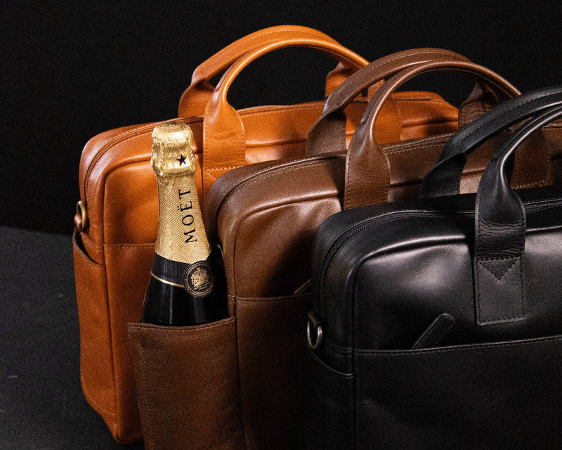 Laptop bag from Gentlemen's as a luxury gift with a bottle of champagne.